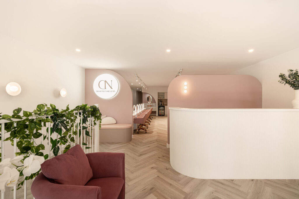 Contemporary feature tiles & custom concrete basins, ceramic pink wall sconces and arched walls & a curved reception counter for this wellness & beauty fit out for Diamond Nails, Total Fitouts Sunshine Coast South